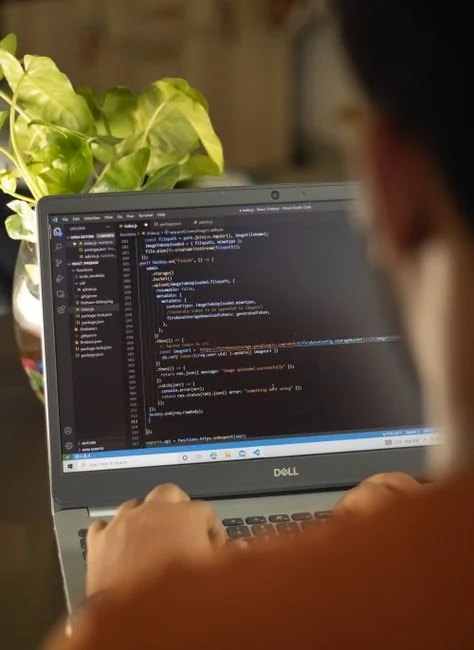 A miniature shopping cart placed on a laptop keyboard symbolizing online shopping and e-commerce.